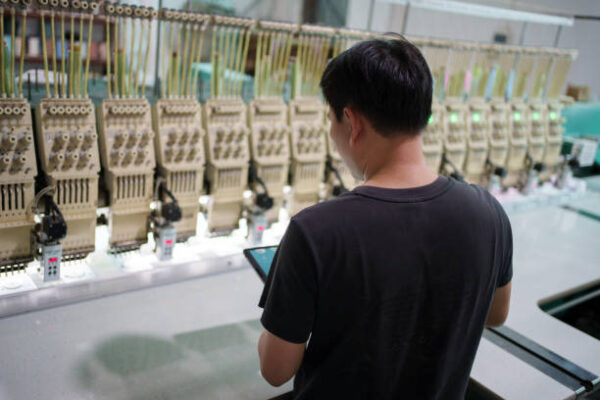 Male worker in textile factory